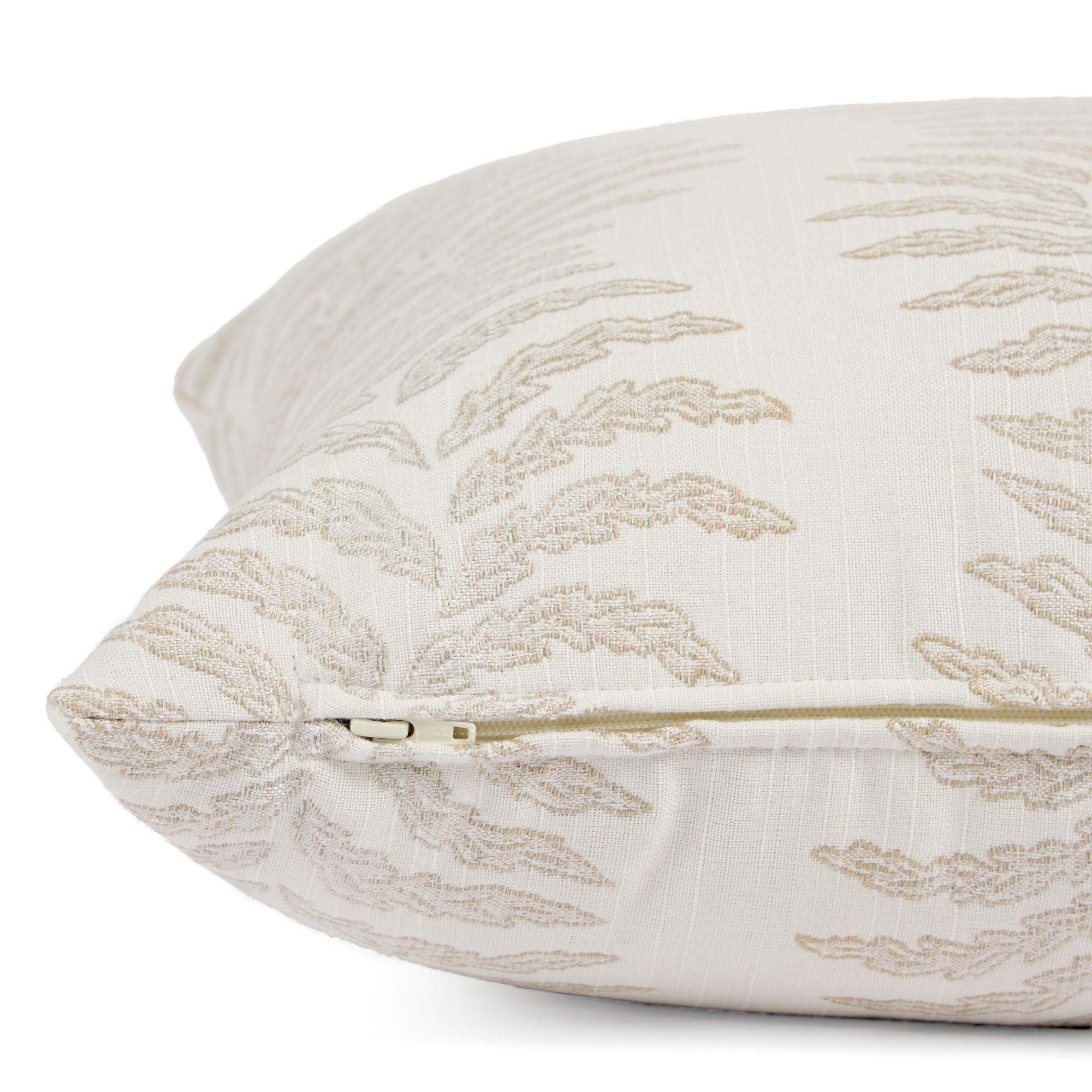 Side zipper detail of Tonic Living Swoon 20x20 outdoor toss pillow in beige and white stripe.
