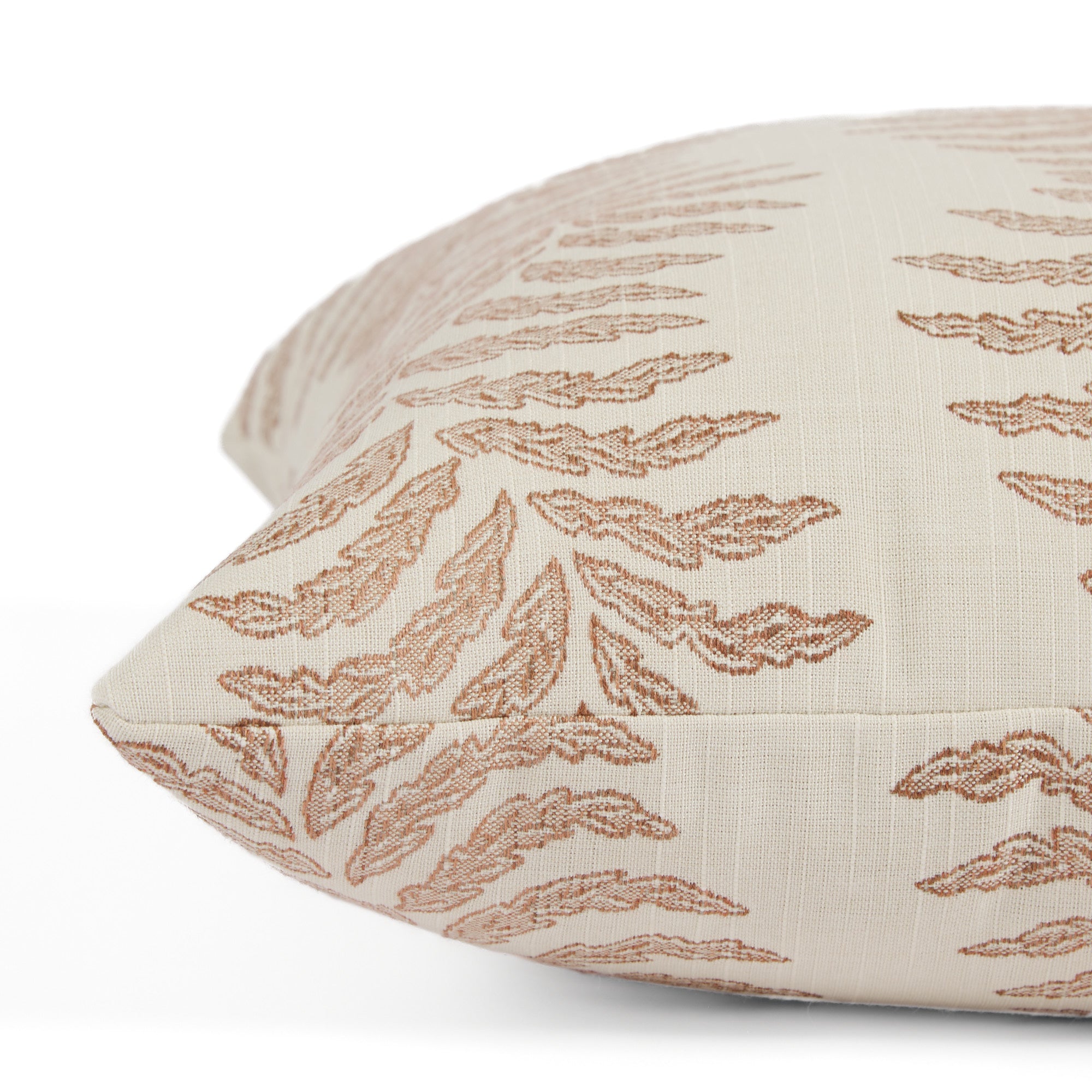 Close up of Tonic Living Swoon Terracotta cushion highlighting its soft woven texture and botanical stripe.