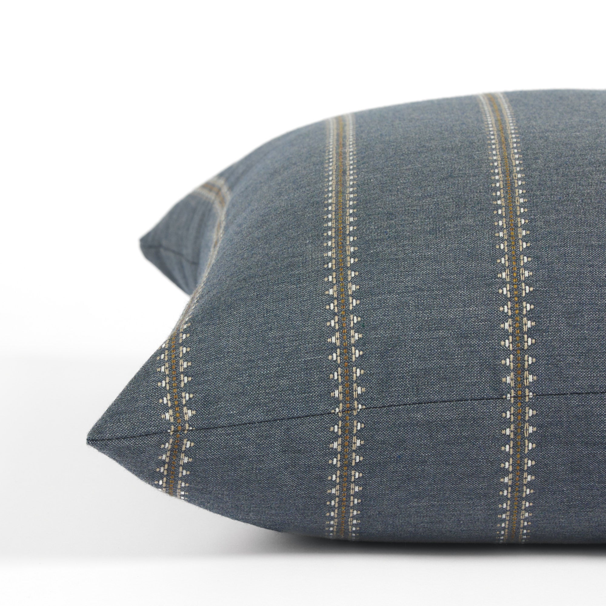 Side view of Tonic Living Talisman Denim decorative cushion highlighting its blue textured stripe design.