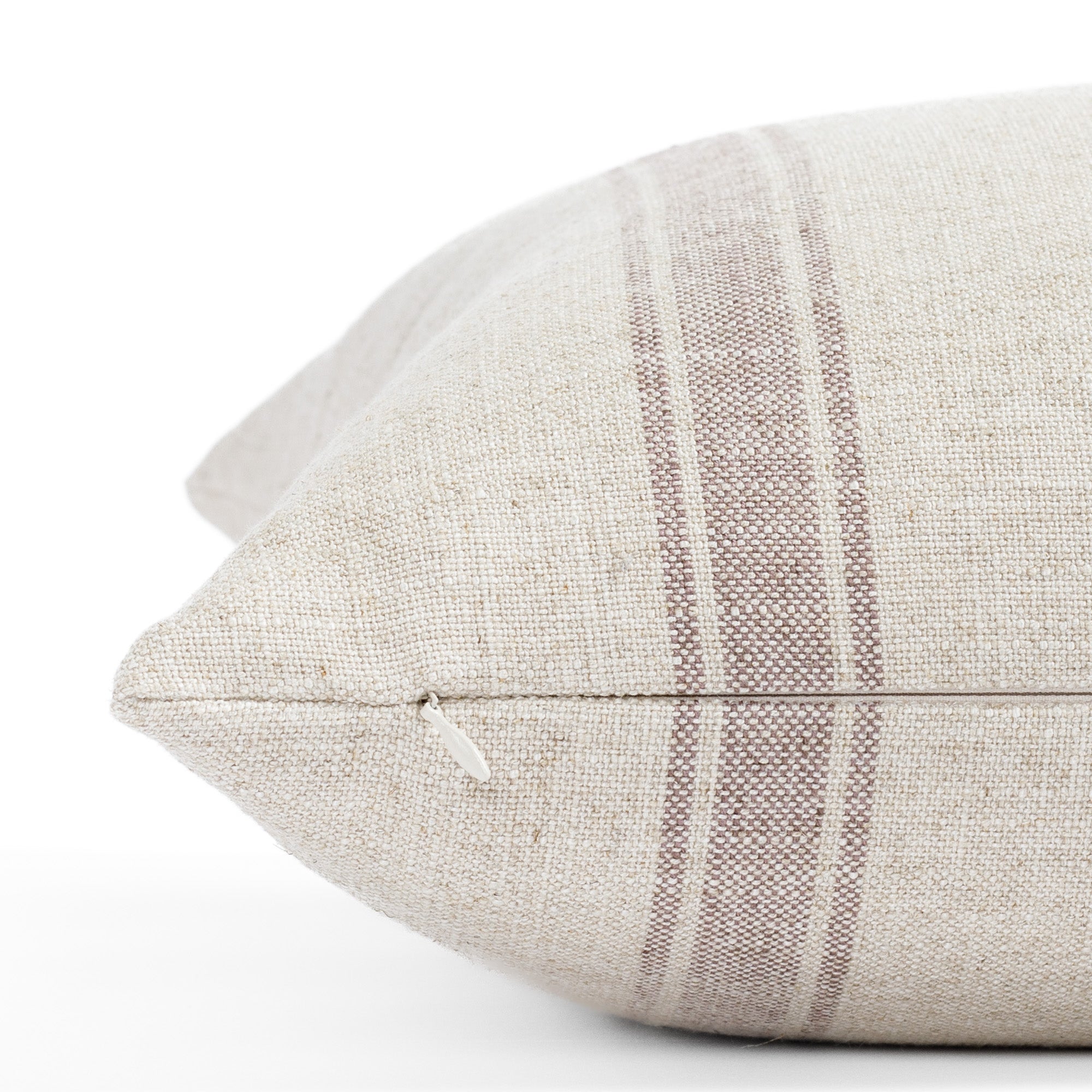 a soft purple and oatmeal striped throw pillow : close up zipper view