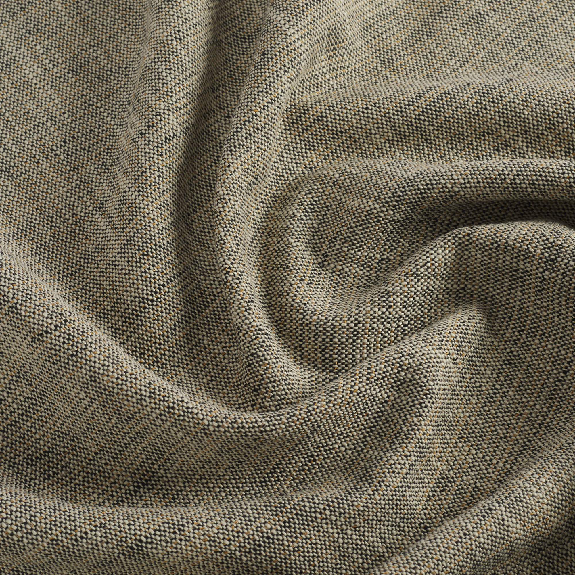 Close up of Tonic Living Troy InsideOut Sable fabric showing a multi-tone weave in black, brown, and beige.