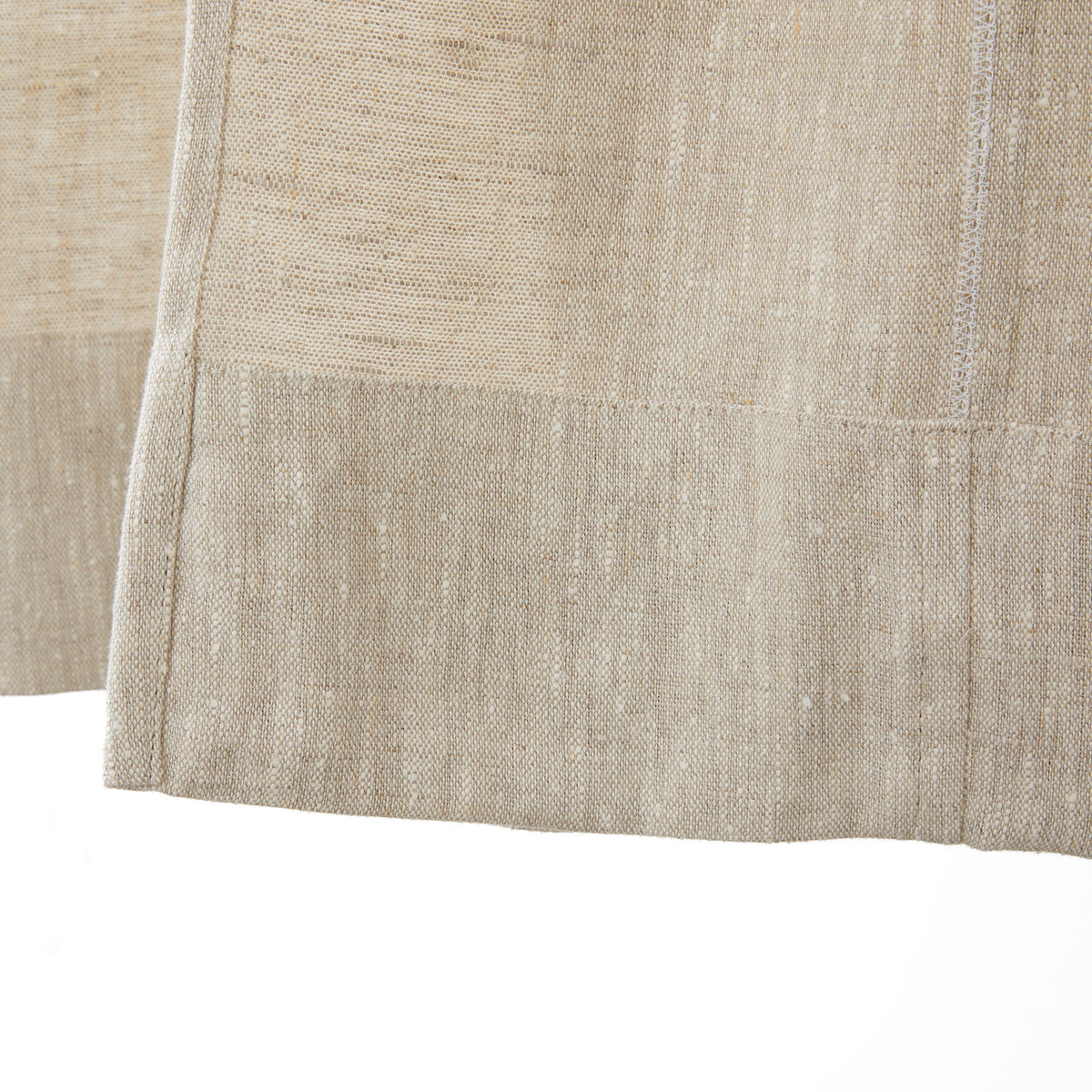 Inside bottom hem detail of Tonic Living Tuscany Linen Shower Curtain in Oatmeal Slub showing the finished linen construction.