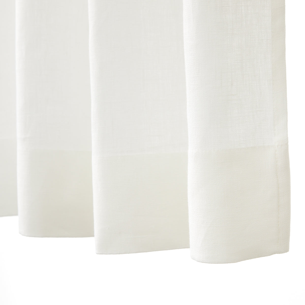 Bottom hem detail of Tonic Living Tuscany Linen Shower Curtain in Oyster showing its tailored finish and warm white linen texture.