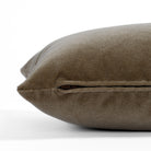 Valentina Velvet Toffee 12x24 Lumbar Pillow from Tonic Living, a coffee brown velvet toss pillow with a subtle sheen: close-up zipper view.