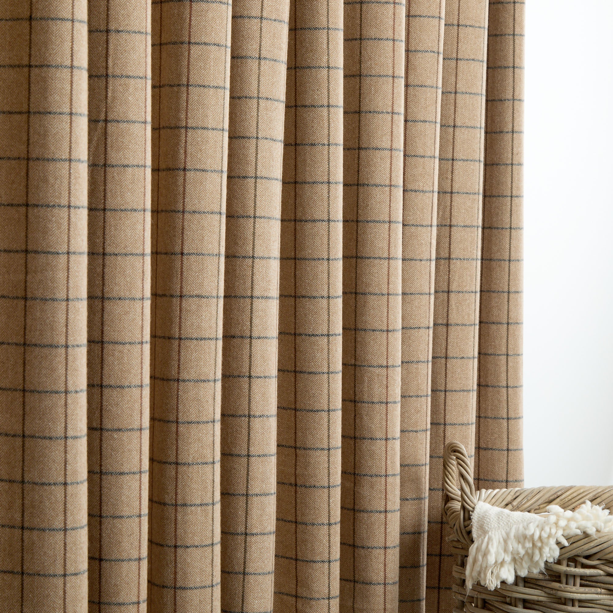 Tonic Living Walker Plaid Camel drapery fabric shown as curtains featuring a classic camel, brown, and navy windowpane check.