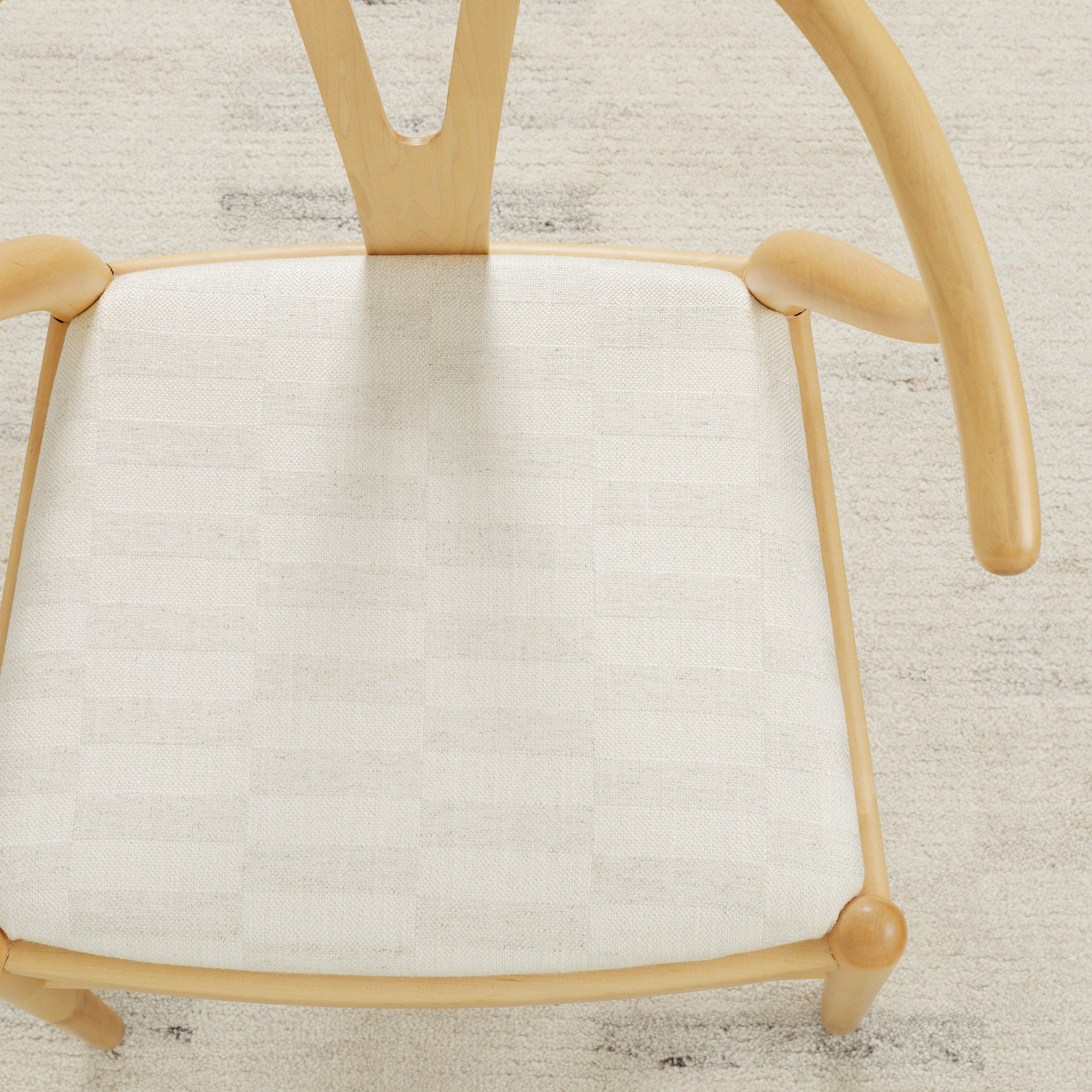 Tonic Living Webster Buff upholstery fabric on a dining chair seat featuring a cream and greige checkerboard design.