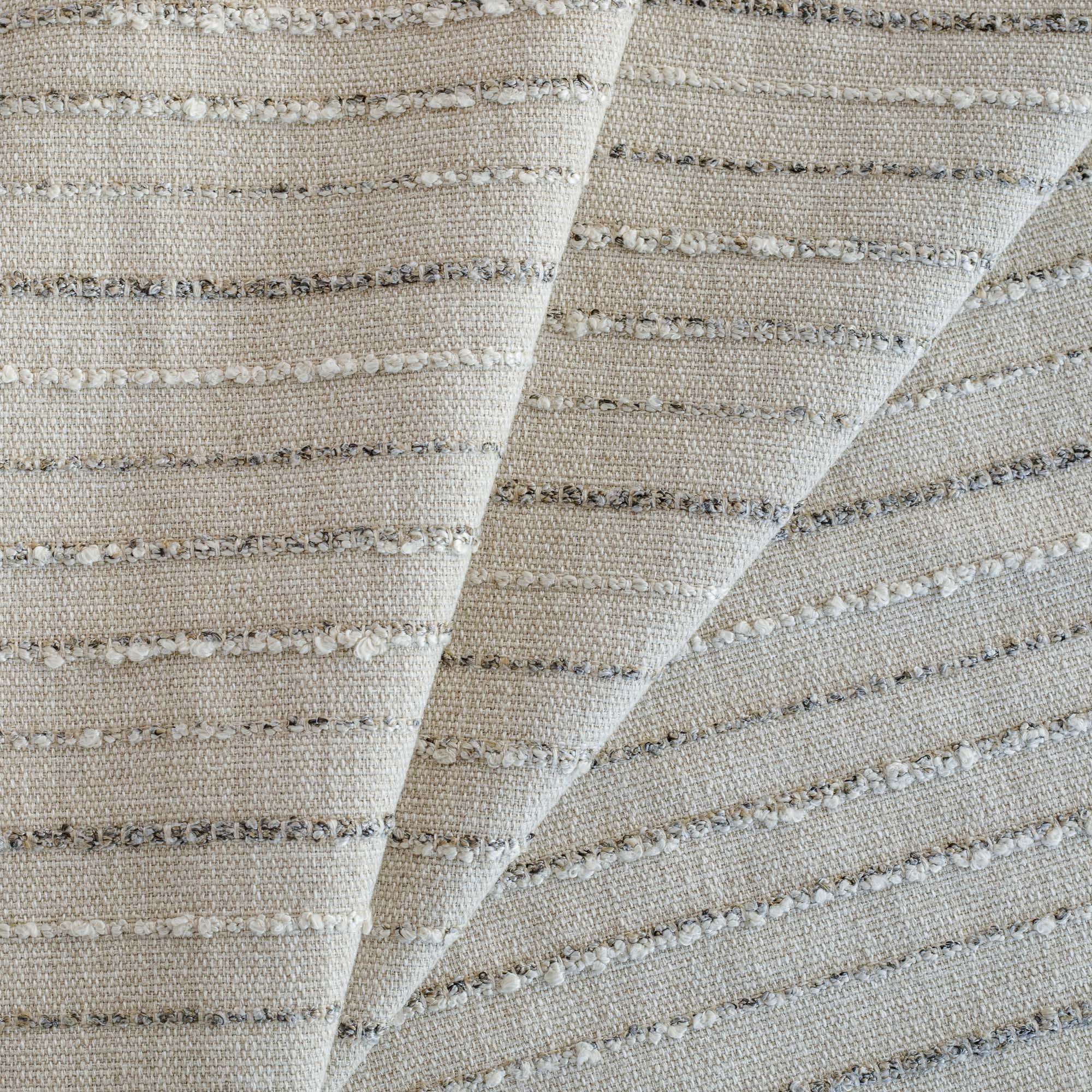 a neutral beige and grey textured striped upholstery fabric