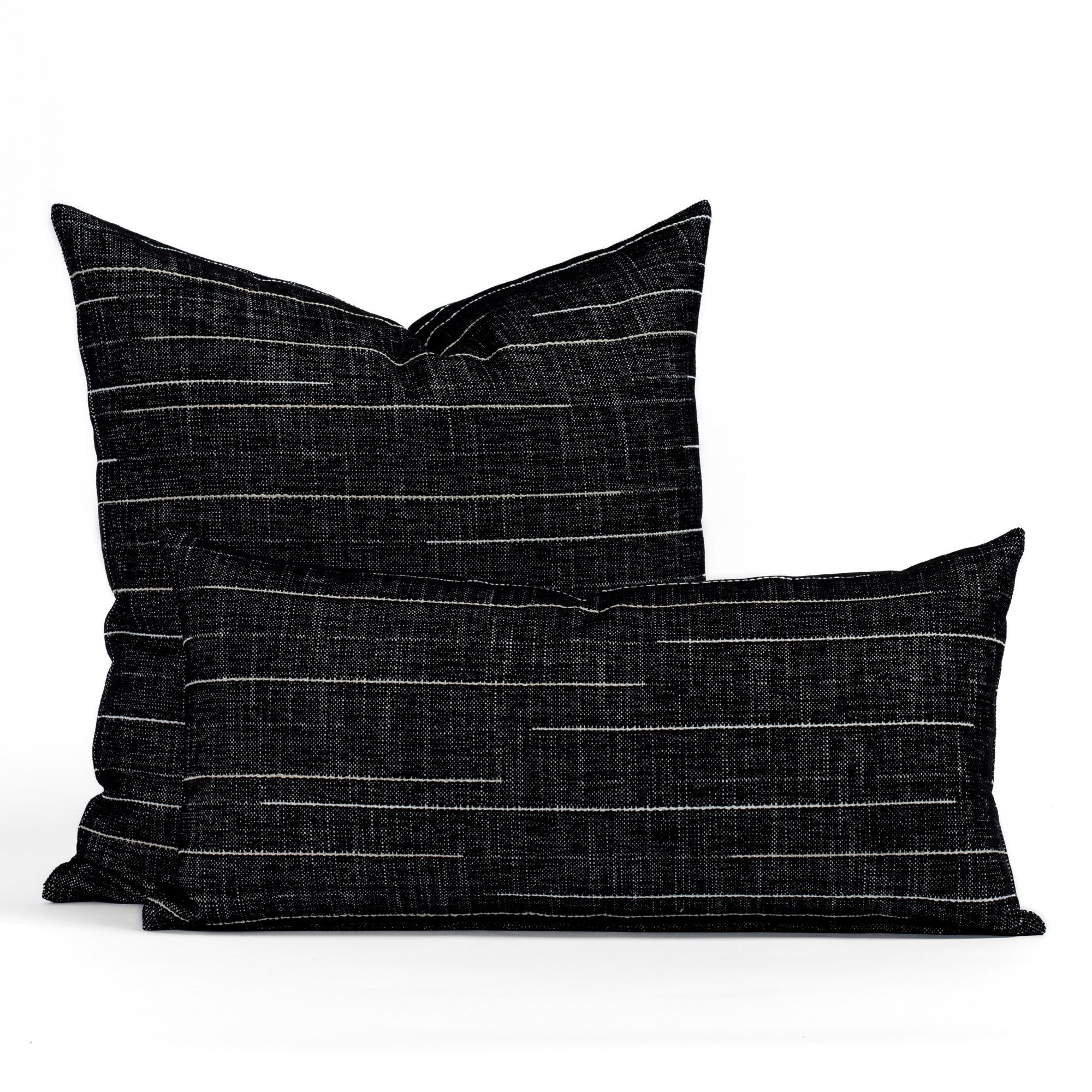 Two Yuzu Onyx pillows - black and white striped indoor/outdoor throw pillows from Tonic Living.