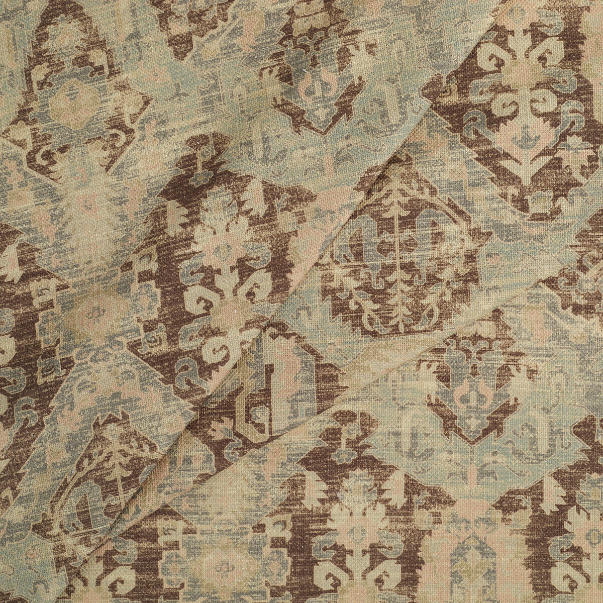 Tonic Living Zuri Driftwood multi-use upholstery and drapery fabric with a faded medallion design inspired by an antique kilim rug.