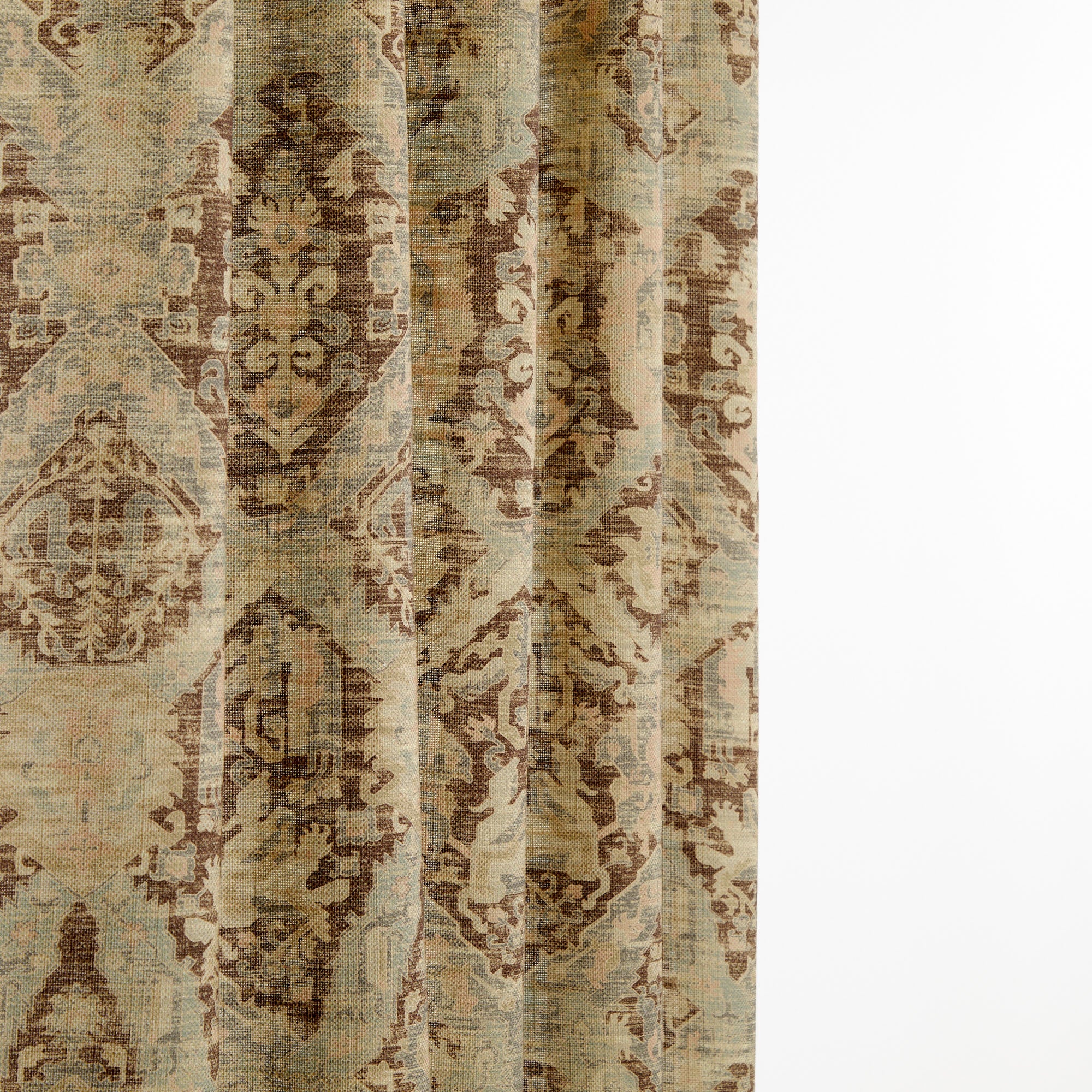 Tonic Living Zuri Driftwood curtain fabric shown draped, highlighting its soft movement and timeworn medallion pattern.