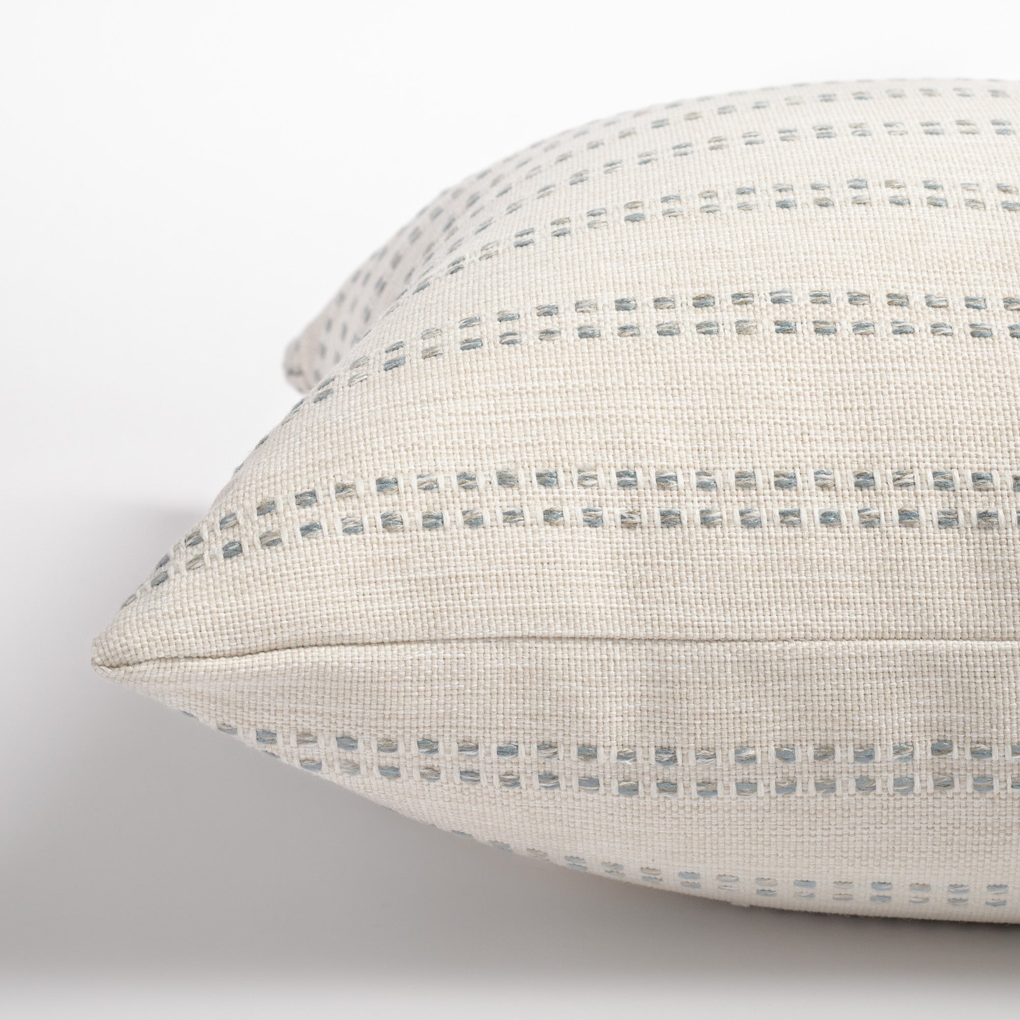 Elodie Sky, a cream white with sky blue dotted stripe pillow from Tonic Living