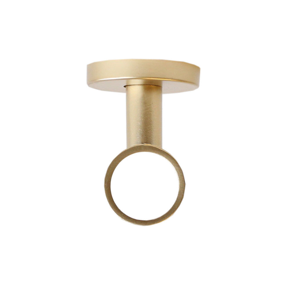 Matte gold ceiling bracket drapery hardware from Tonic Living