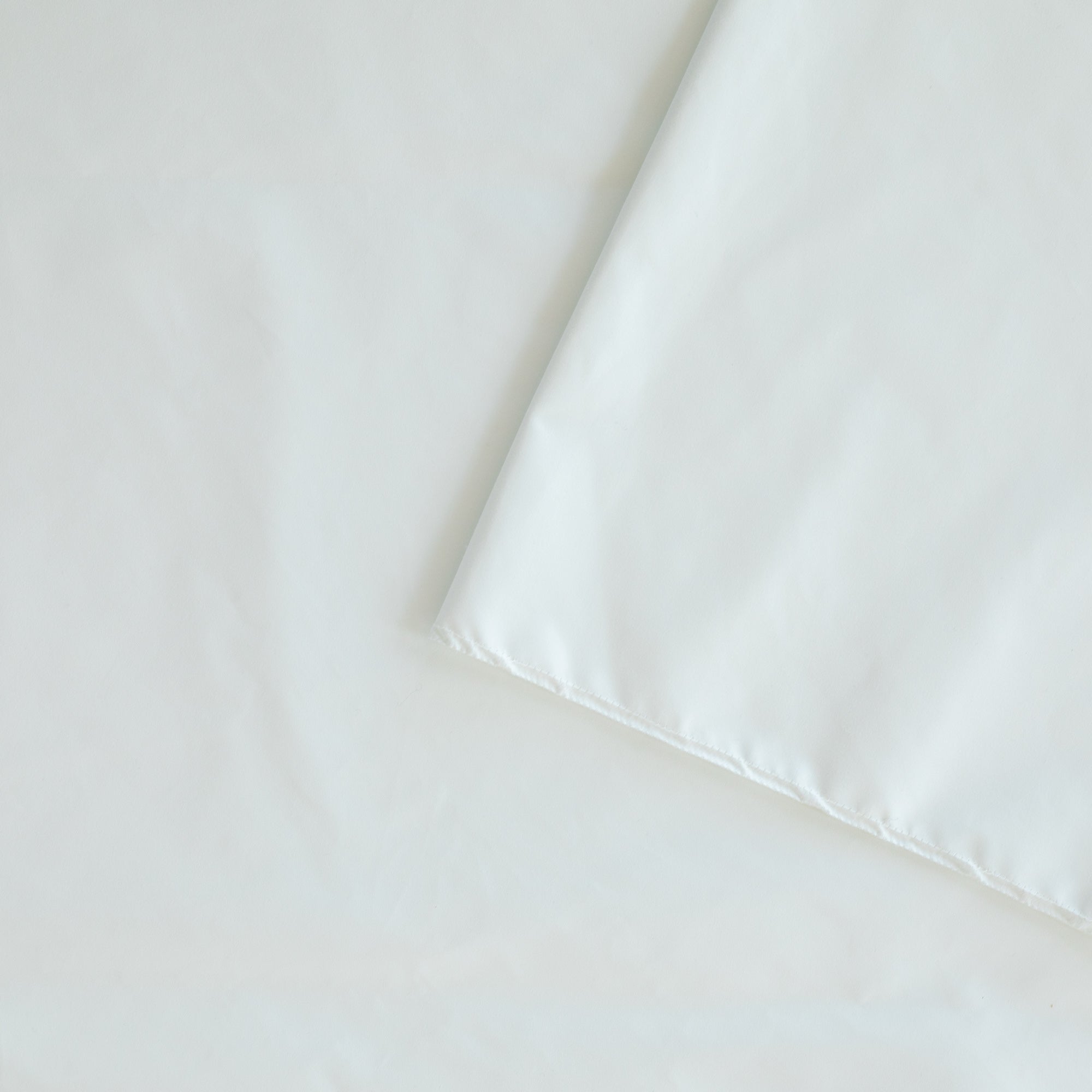 White dim out lining by Tonic Living for drapery, curtains and roman blinds