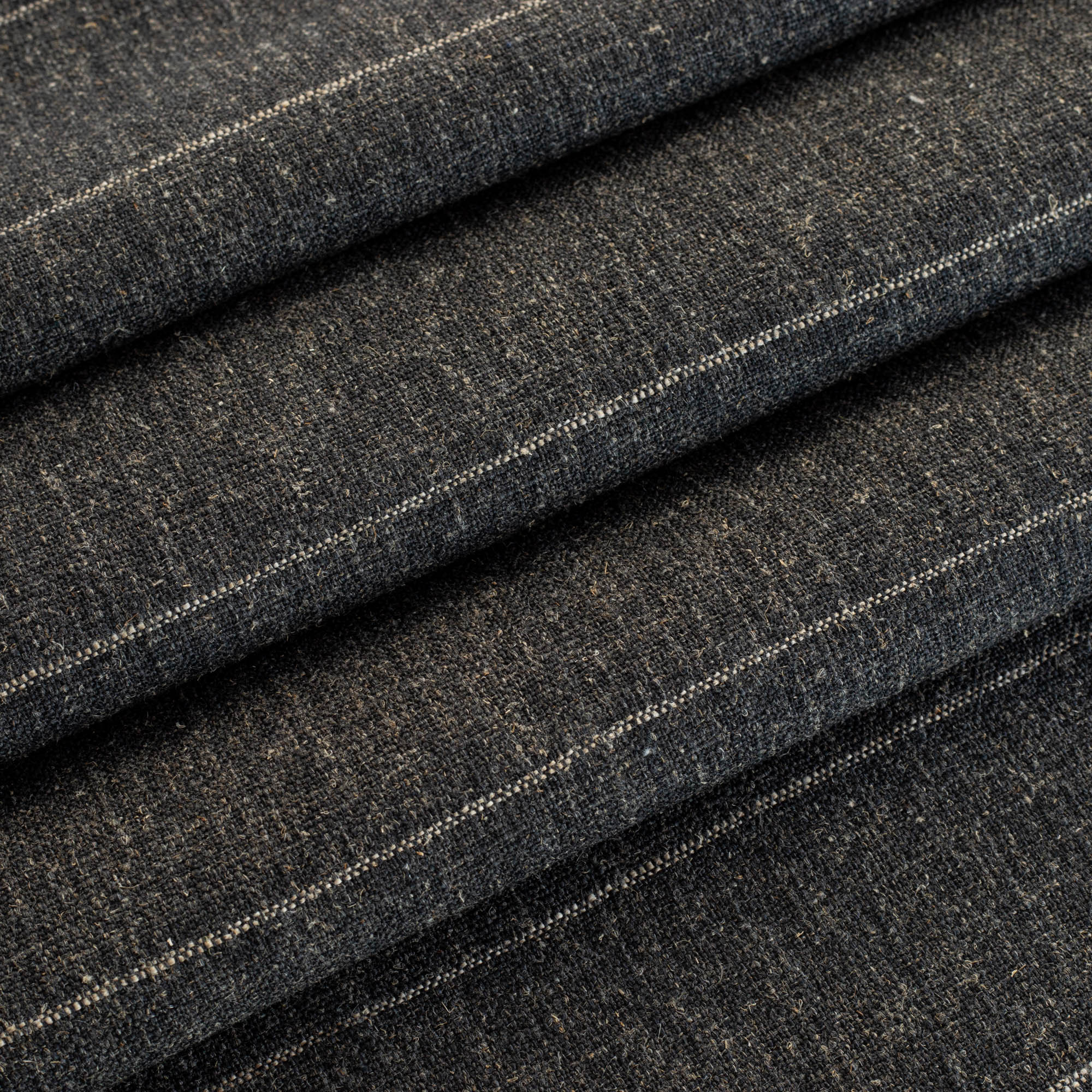 a charcoal grey and tan stripe upholstery fabric