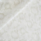 a soft white and beige floral print sheer fabric