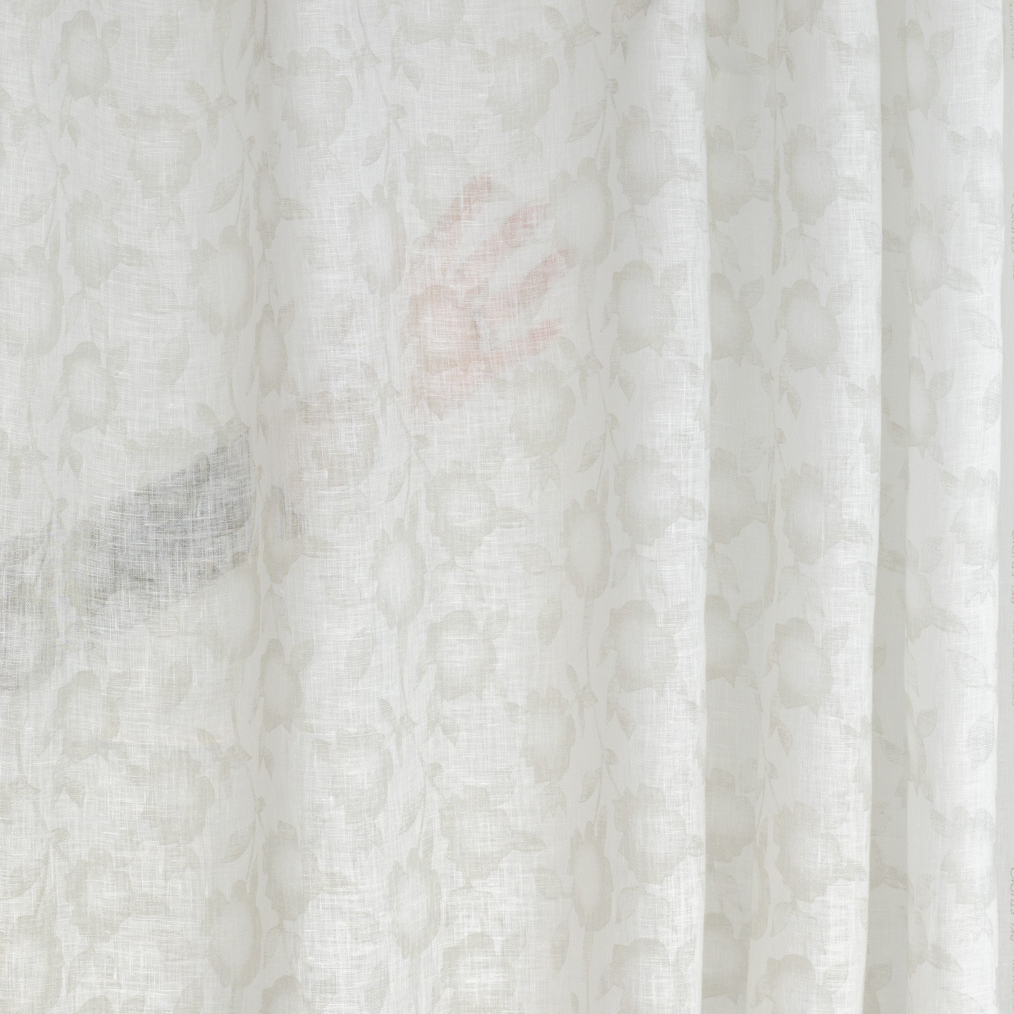 a soft white and beige floral print linen sheer drapery fabric