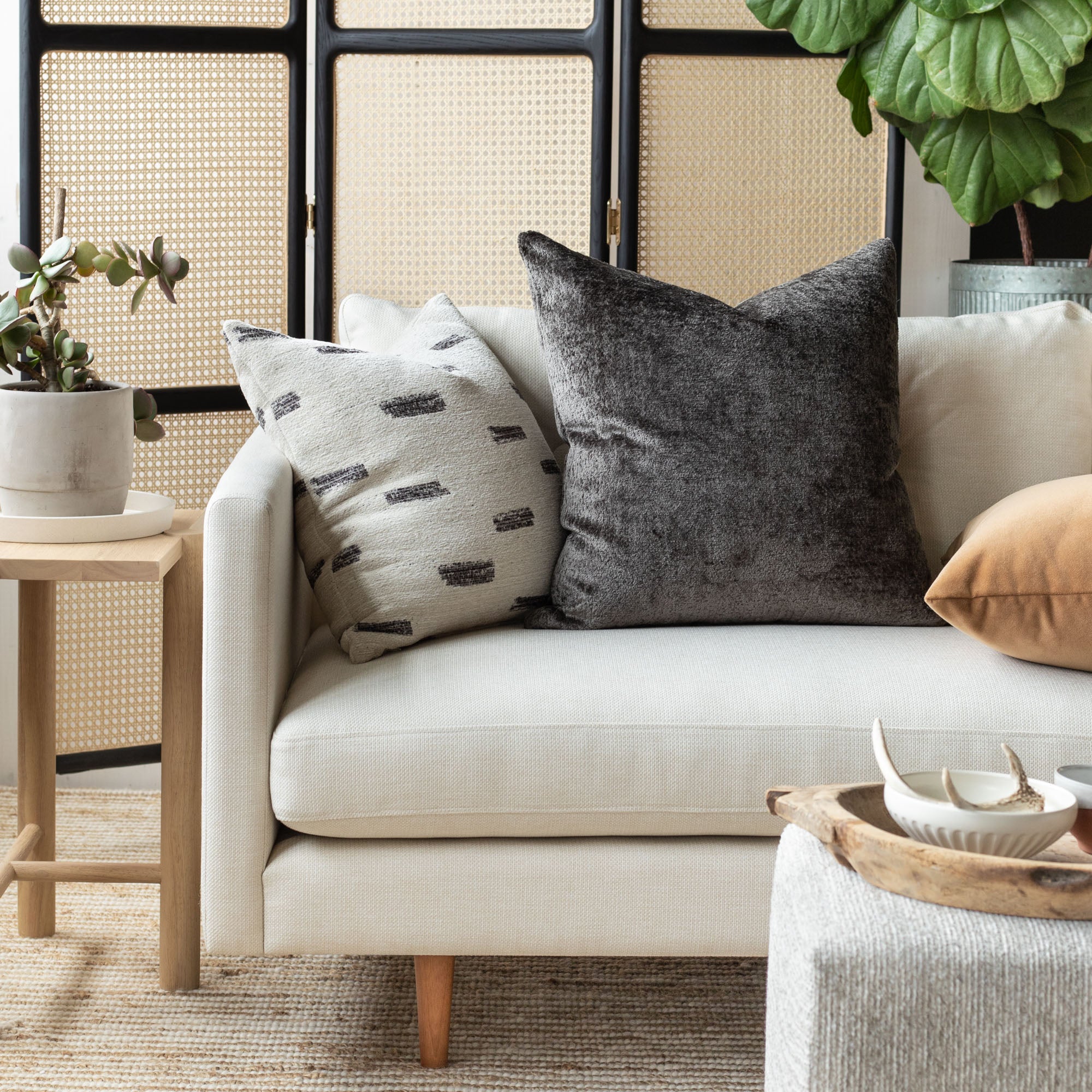 Black and cream home decor: Ginsberg pewter grey velvet and Stratus cream  pillows from Tonic Living