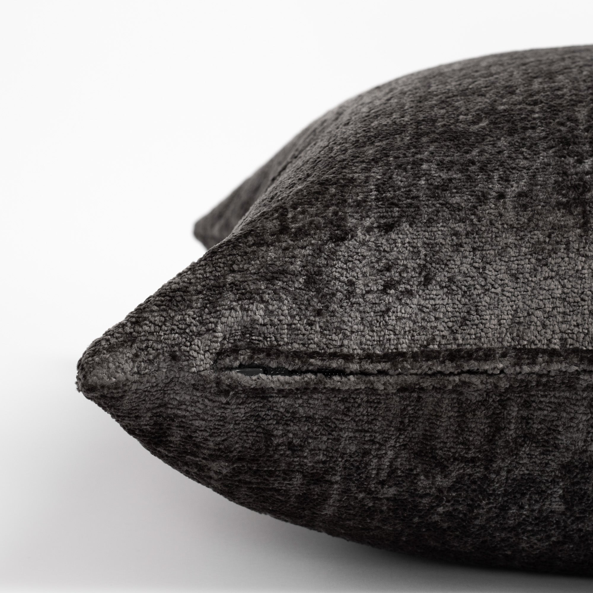 Ginsberg Velvet 22x22 Pillow Pewter, a charcoal grey velvet pillow : close up zipper side