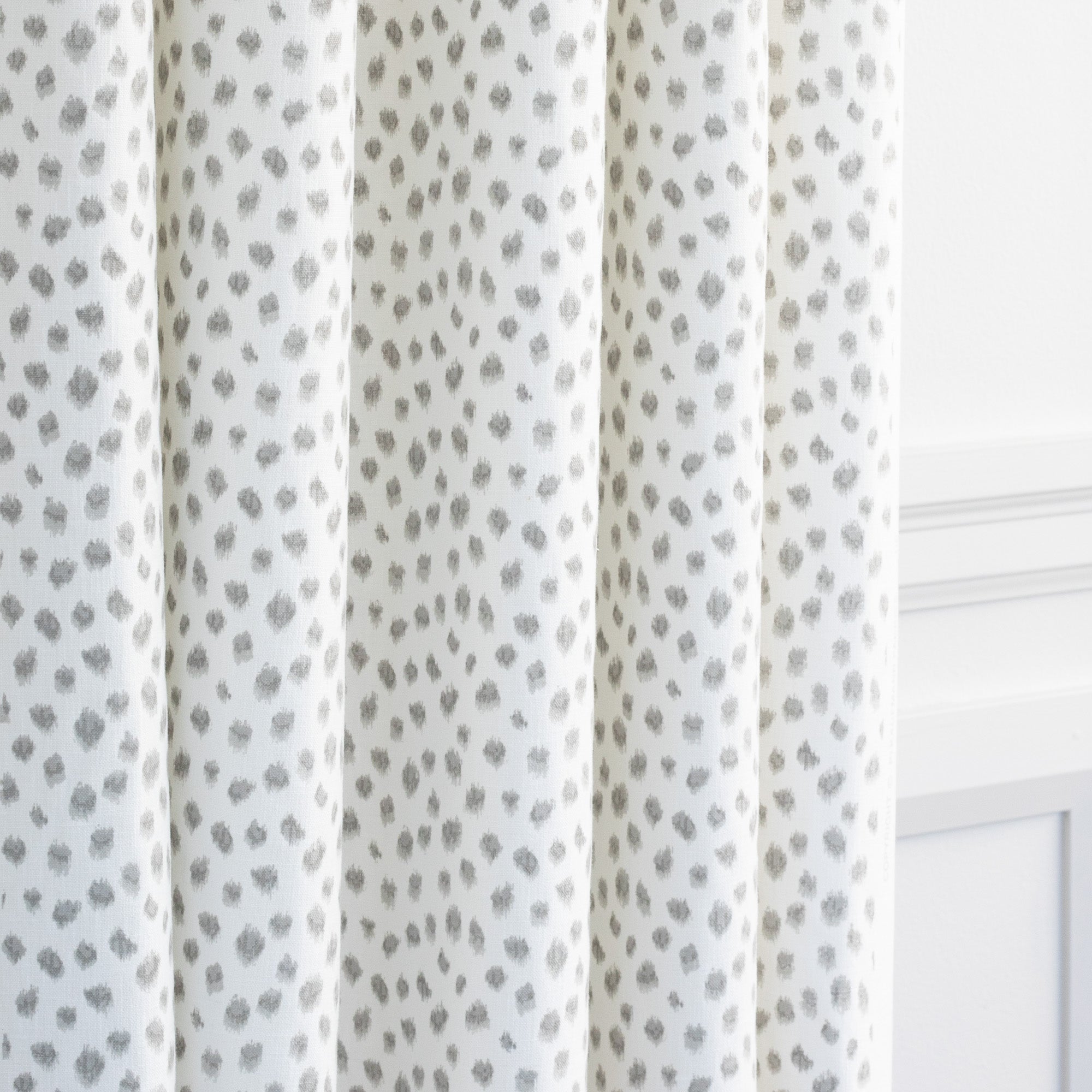 a white and silver grey inky dot print drapery fabric