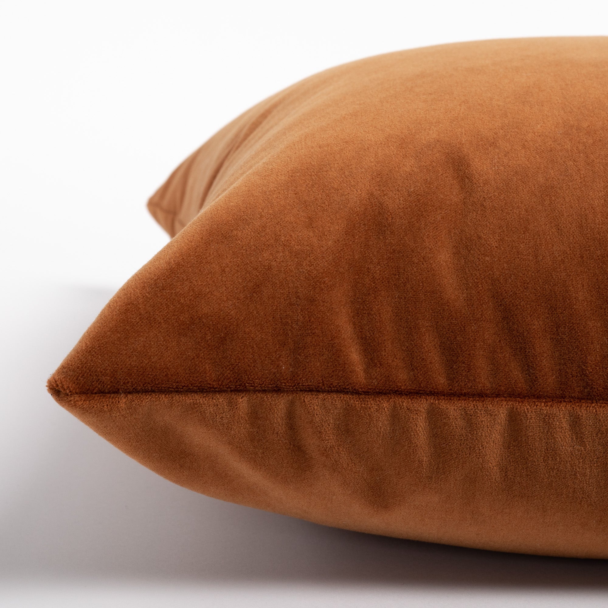 Mason Velvet Cognac, a rusty, burnt orange velvet pillow : close up side view