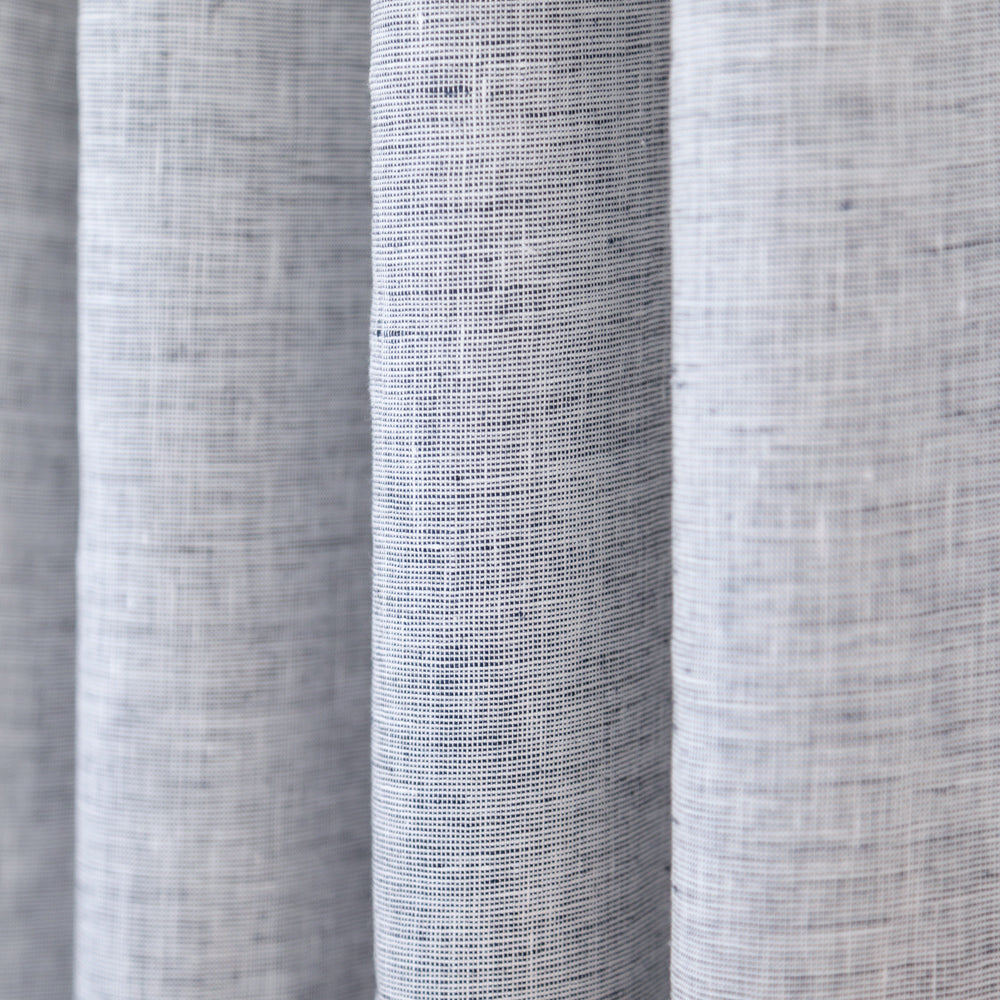 Normandy Linen Salt and Pepper, a white and deep navy blue linen drapery fabric from Tonic Living