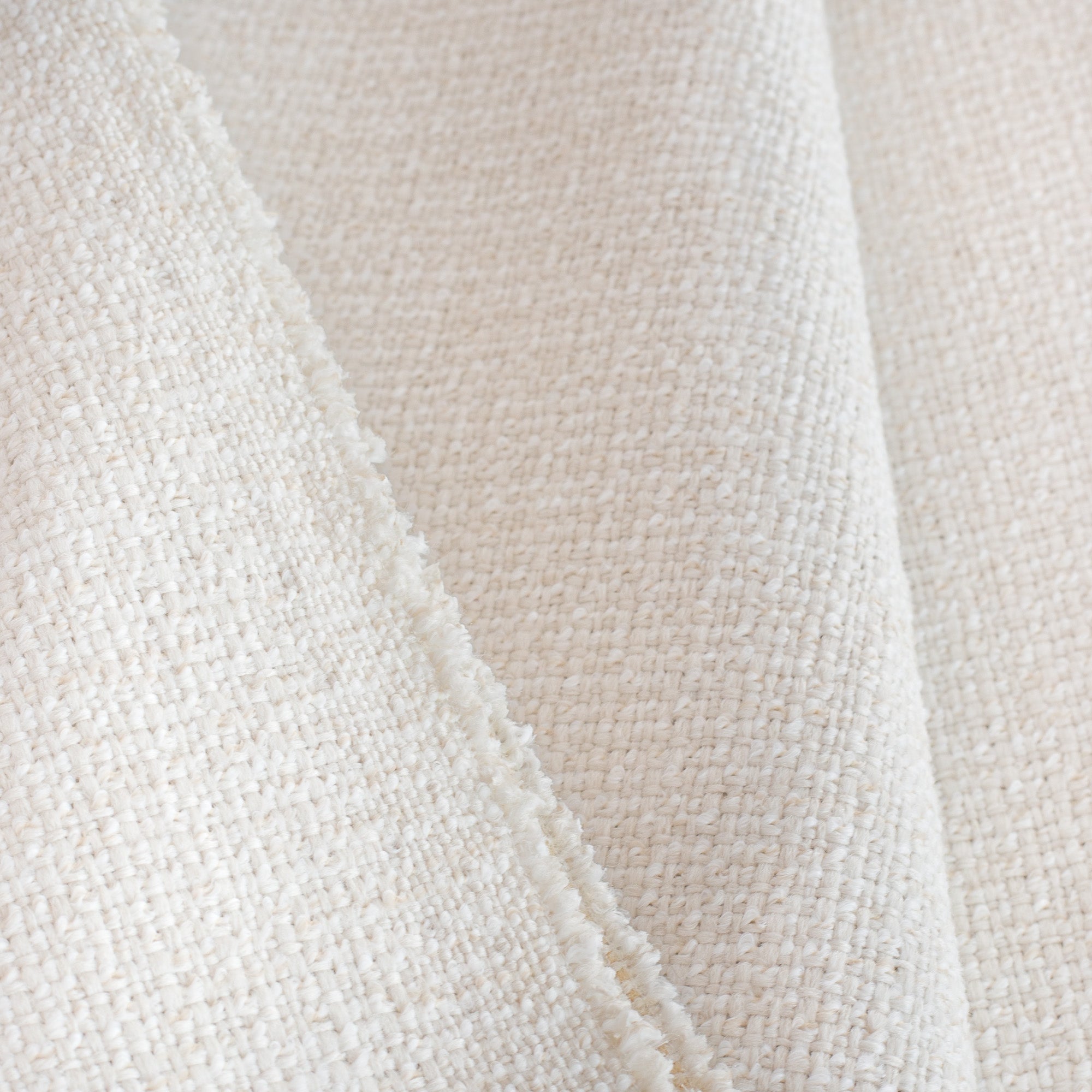 Preston Oyster, a light cream basket weave performance upholstery fabric