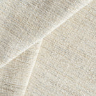 a beige textured woven upholstery fabric