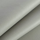 a grey vinyl performance upholstery fabric : close up view