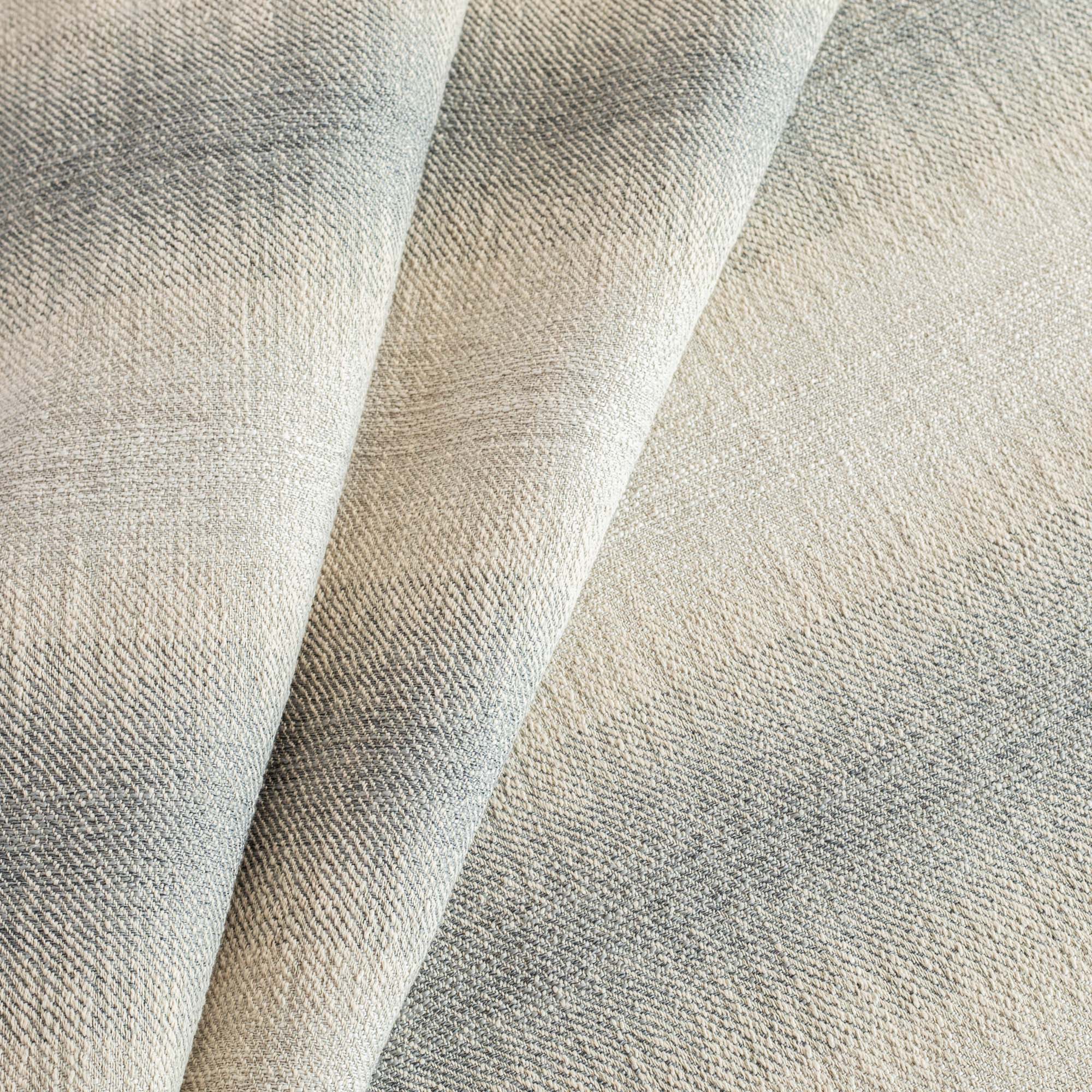 a denim blue and sandy grey ombre stripe Tonic Living upholstery fabric
