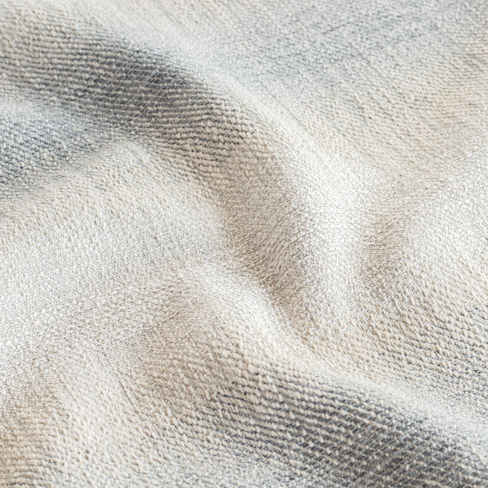 a denim blue and sandy grey ombre stripe home decor fabric
