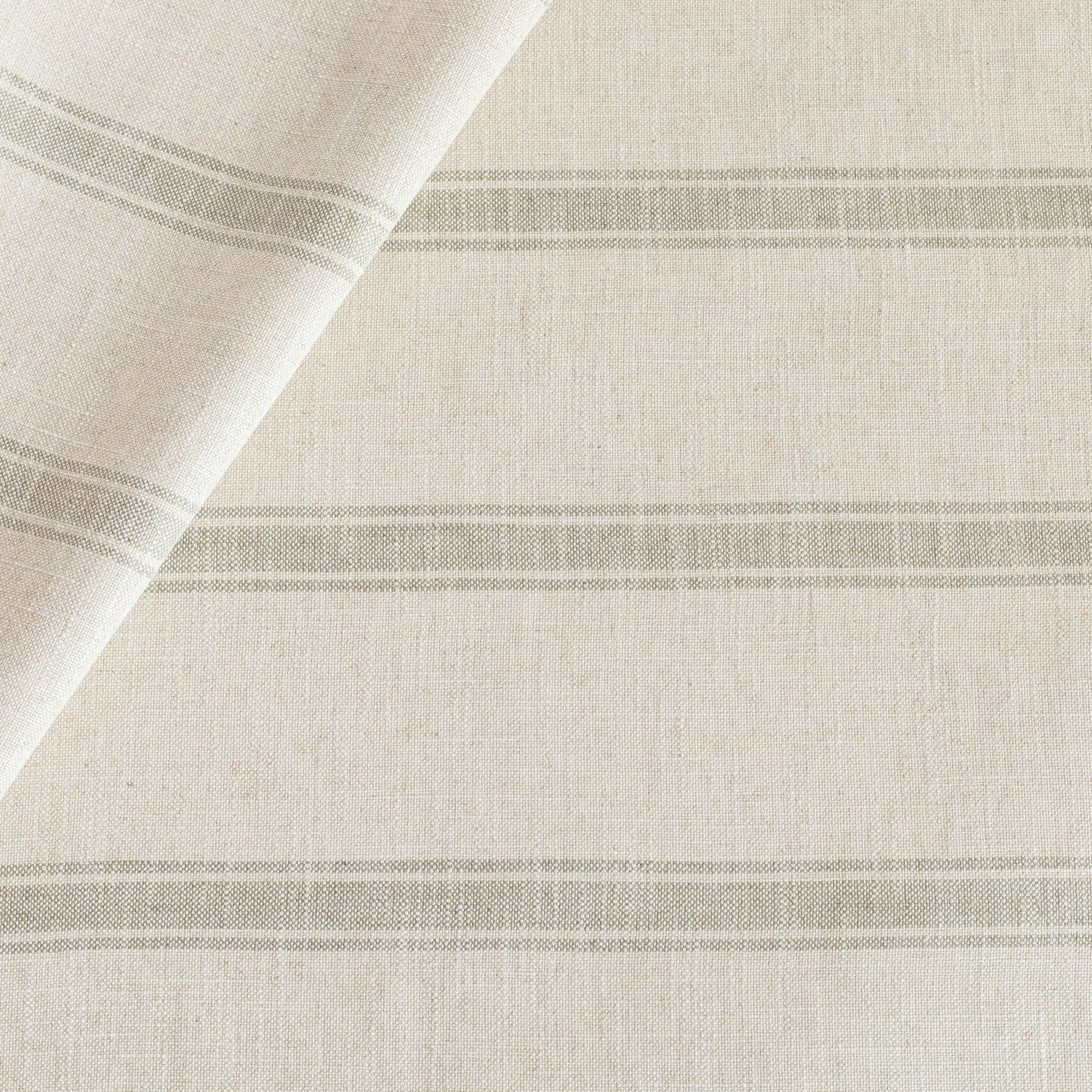 a watery blue and cream stripe upholstery fabric from Tonic Living
