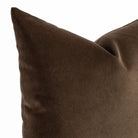 a deep brown velvet throw pillow