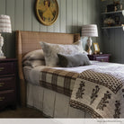 camel plaid upholstered headboard in bedroom