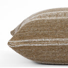 Acadia Cinnamon, a light brown and cream striped throw pillow from Tonic Living: close up side view. 