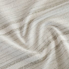 A beige, white and grey high-performance upholstery fabric from Tonic Living.