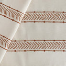 a rusty red and cream woven south west patterned stripe