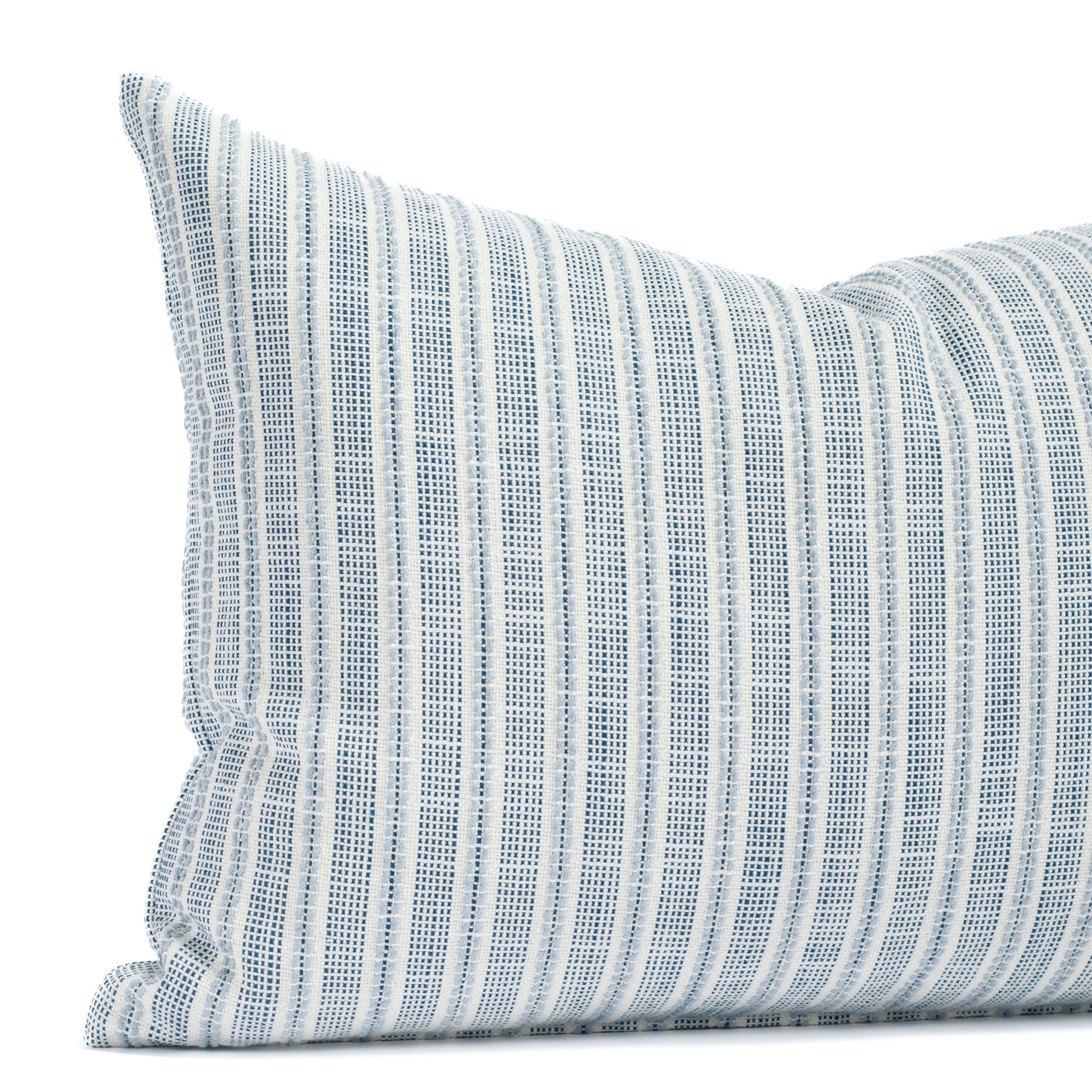 a white and blue outdoor throw pillow : close up view