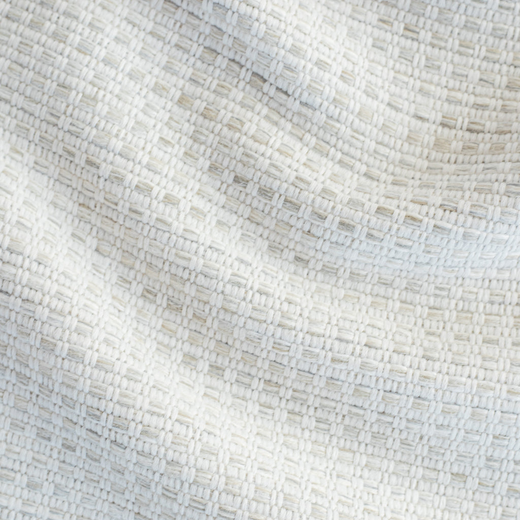 Arlo Fabric Pebble, a white, oatmeal and grey basket weave textured stain resistant upholstery fabric from Tonic Living