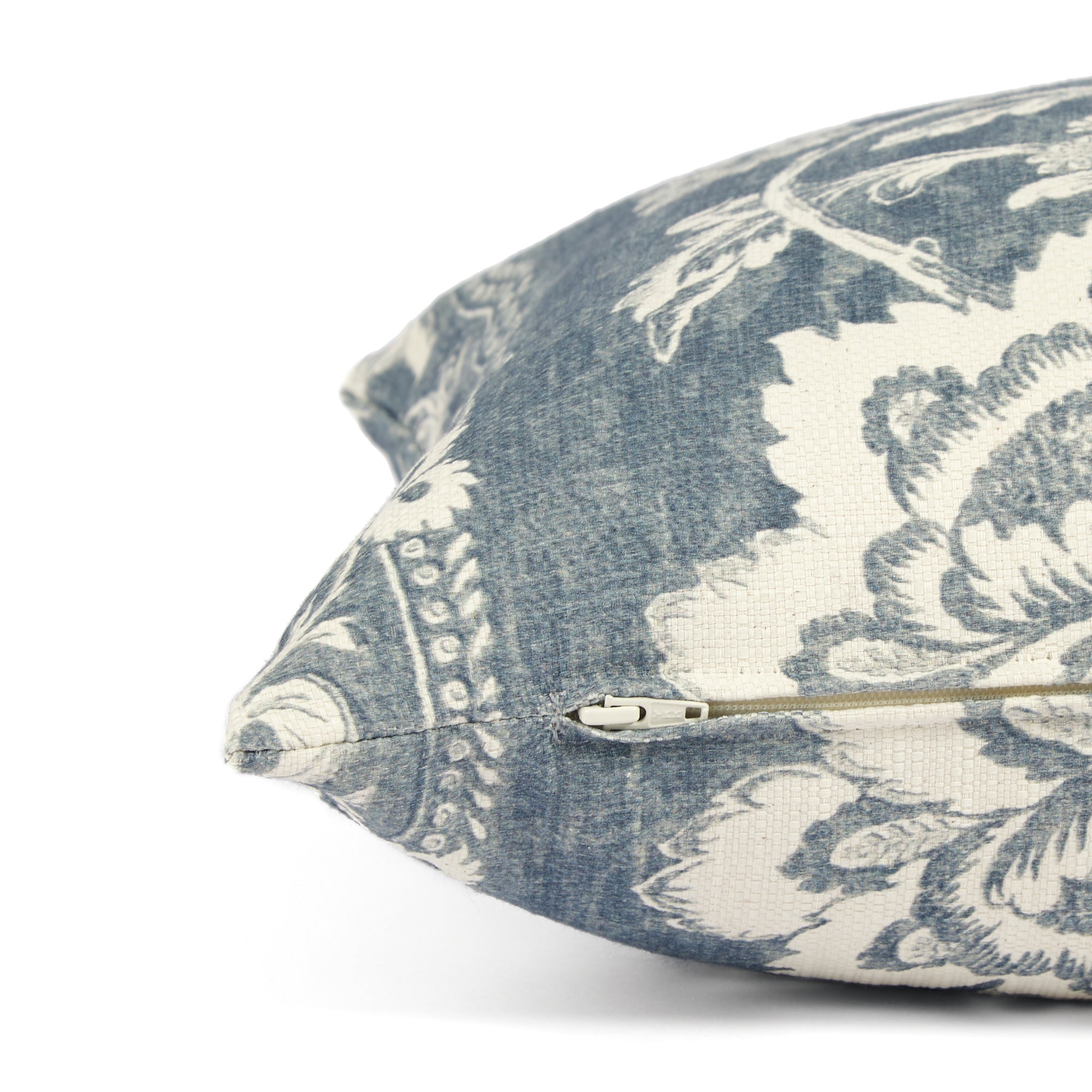 Side zipper detail of Tonic Living Ashford 16x42 bolster pillow in chambray blue floral print.