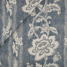 Tonic Living Ashford Fabric in Denim, a chambray blue and white floral upholstery fabric with scrolling vine stripe.