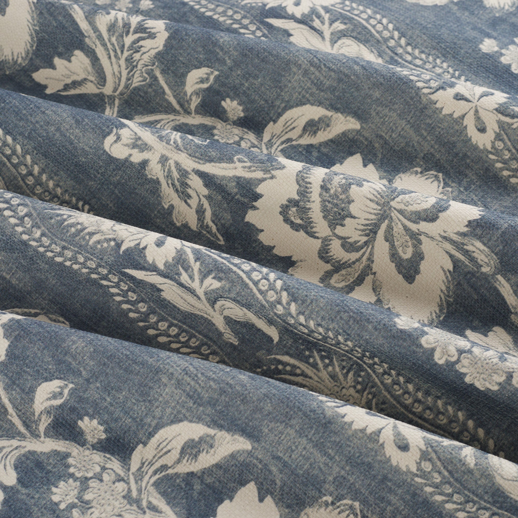 Tonic Living Ashford Denim upholstery fabric with chambray blue botanical vines and soft stripe detail.
