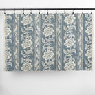 Full yard of Tonic Living Ashford Denim upholstery fabric showing chambray blue floral stripe design.