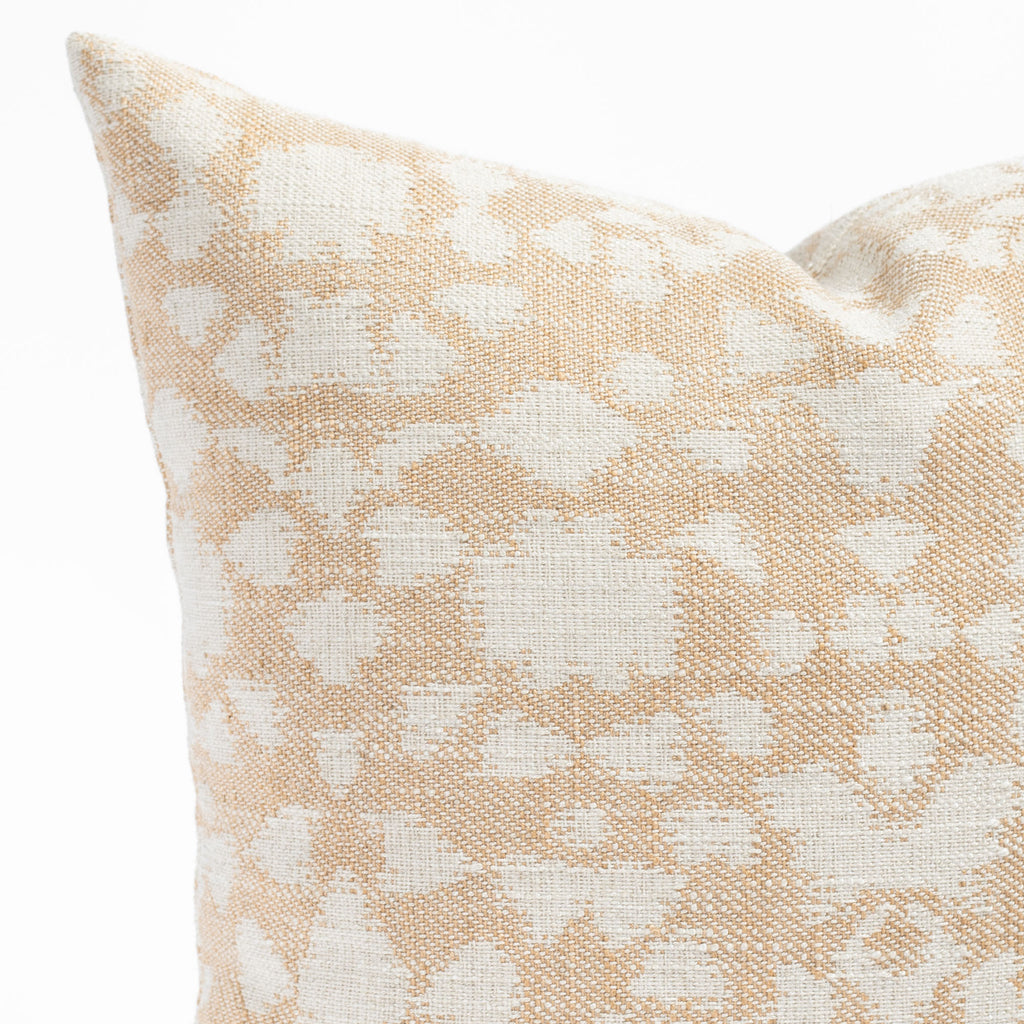 a warm gold and cream abstract botanical patterned throw pillow : close up view