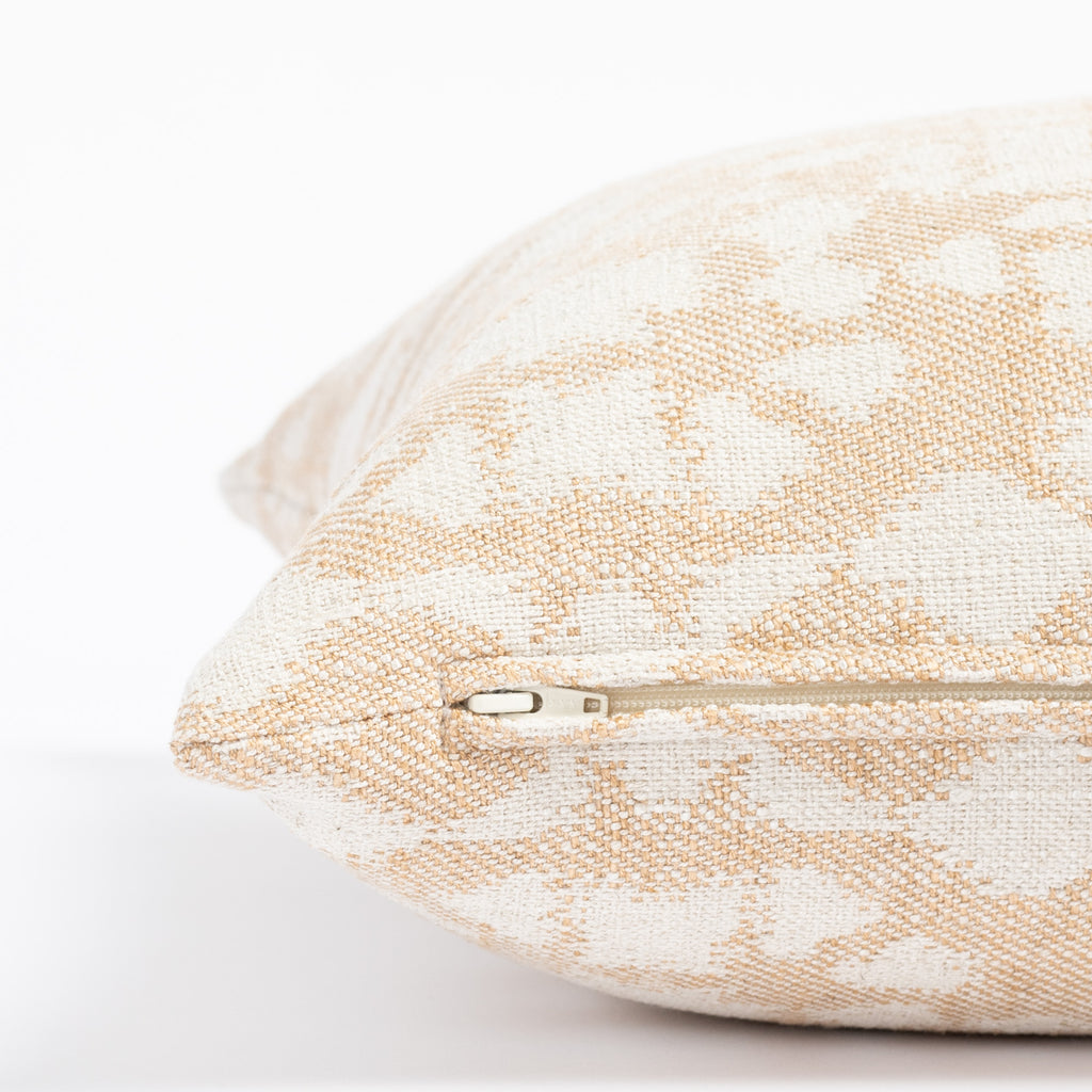 a warm gold and cream abstract botanical patterned throw pillow : close up zipper detail