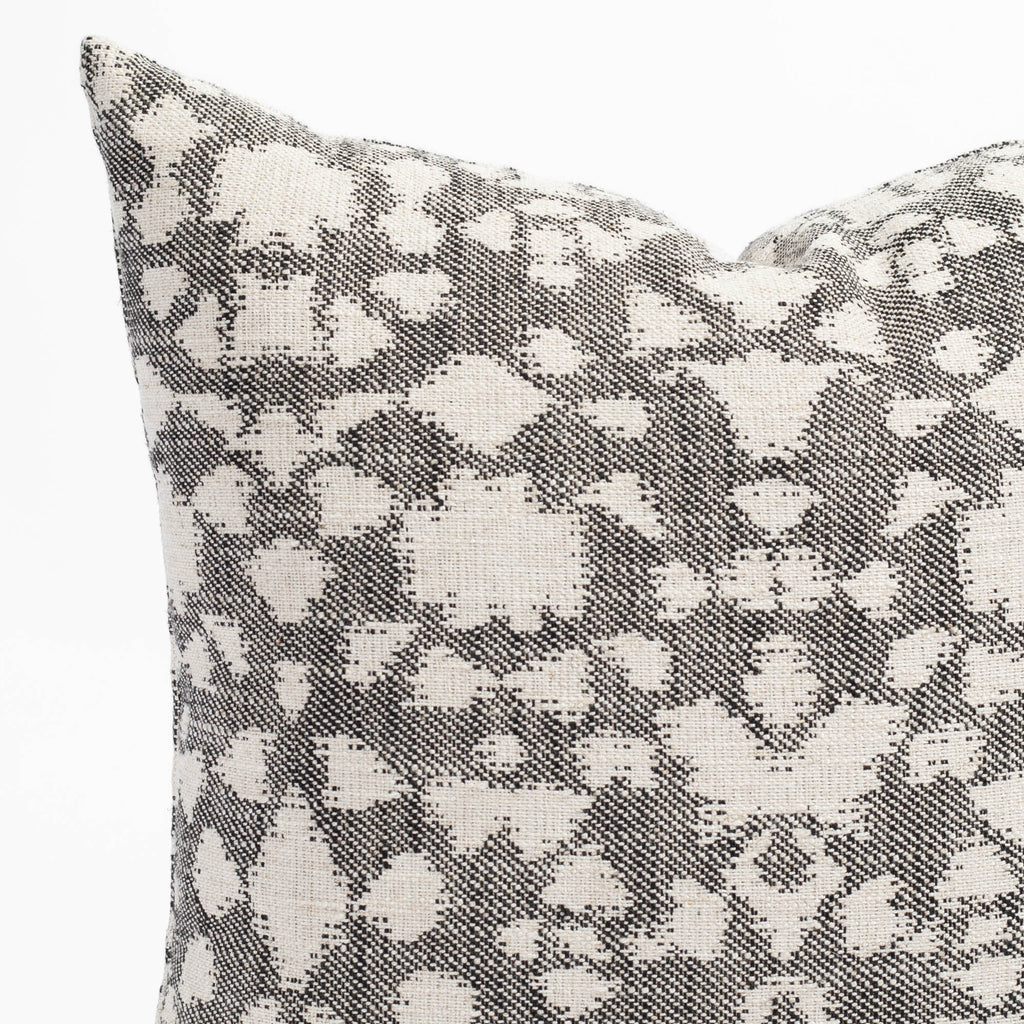 an abstract botanical patterned throw pillow : close up view