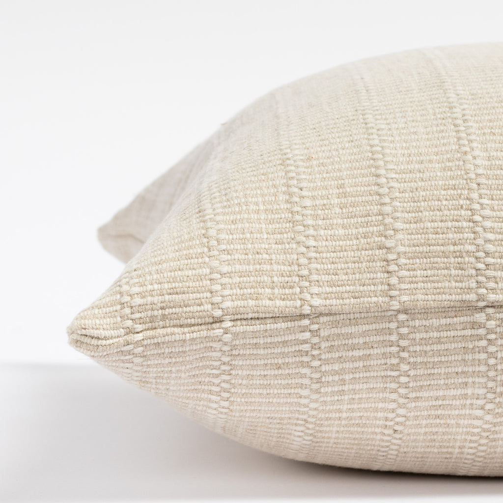 a cream tone-on-tone textured stripe throw pillow : close up side view
