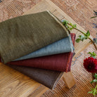 Tonic Living Bedford upholstery fabrics in Moss, Denim, Coffee, and Merlot chenille.
