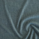 Tonic Living Bedford Denim upholstery fabric in soft medium-blue chenille weave.