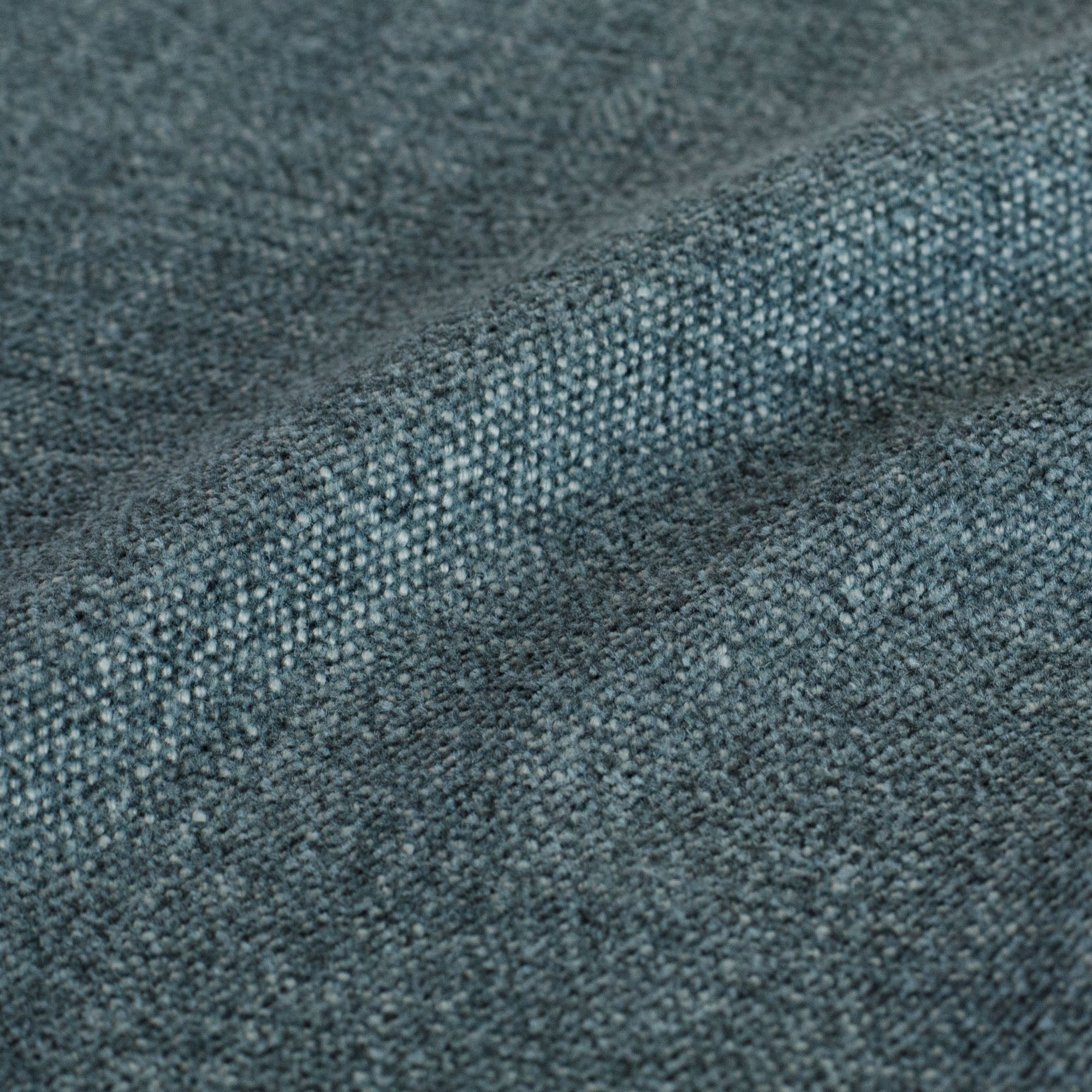 Close-up of Tonic Living Bedford Denim indigo chenille upholstery fabric with texture.
