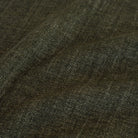 Close-up of Tonic Living Bedford Moss earthy forest-green chenille upholstery fabric.